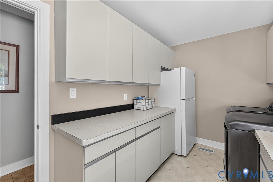 Full-height cabinetry with integrated hardware, expansive countertop space, and under-cabinet storage