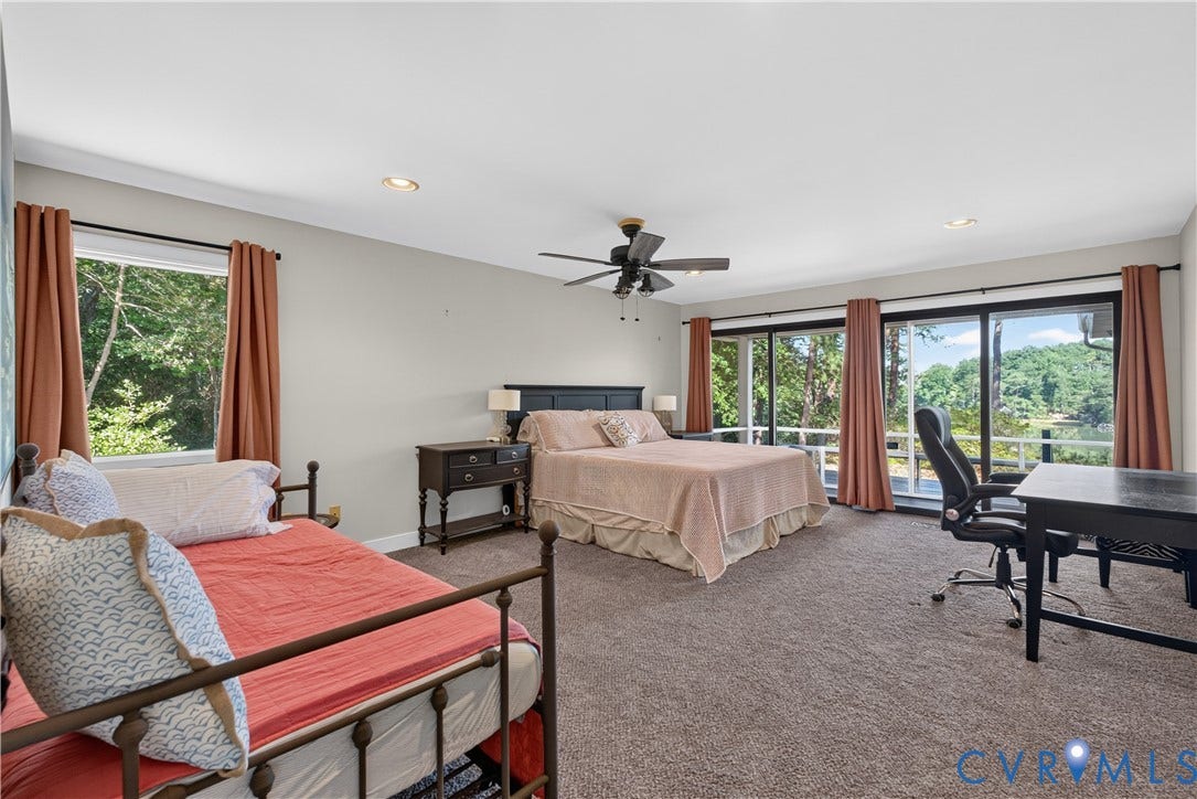 Spacious room featuring carpeting, recessed lighting, and a ceiling fan
