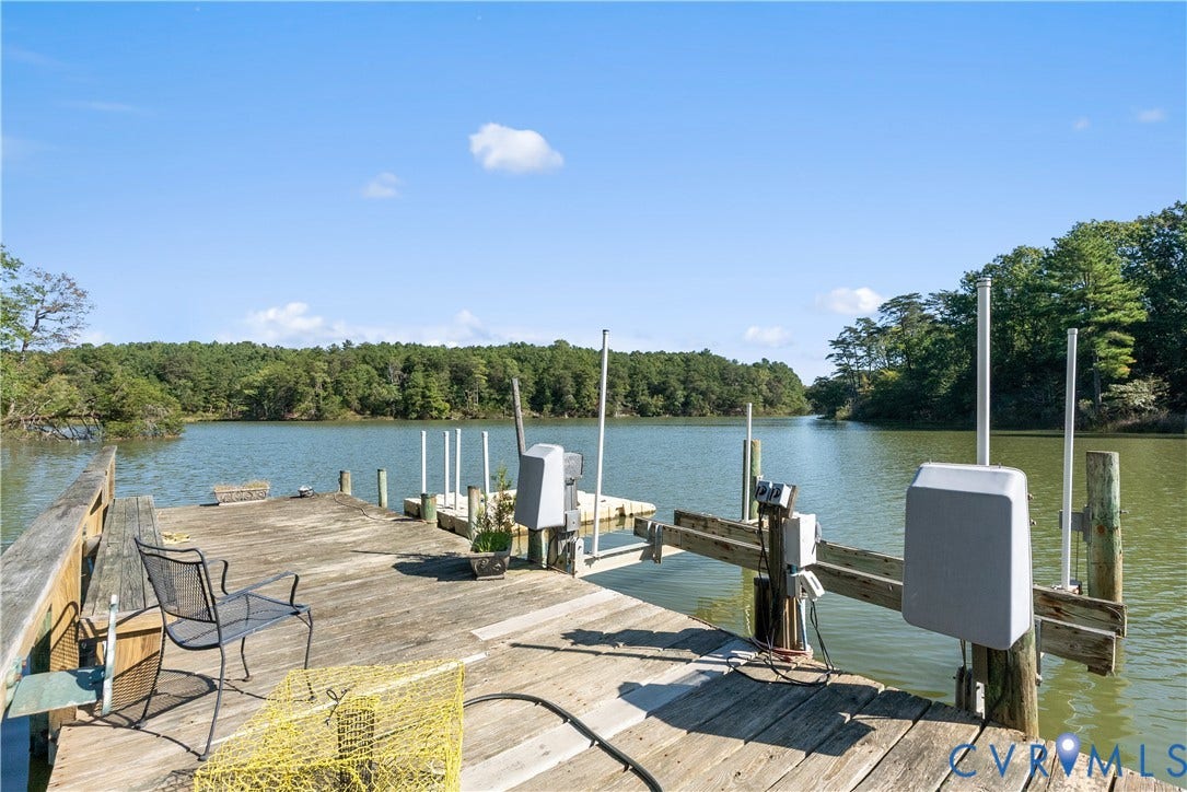 Expansive wood dock with water access and a boat lift