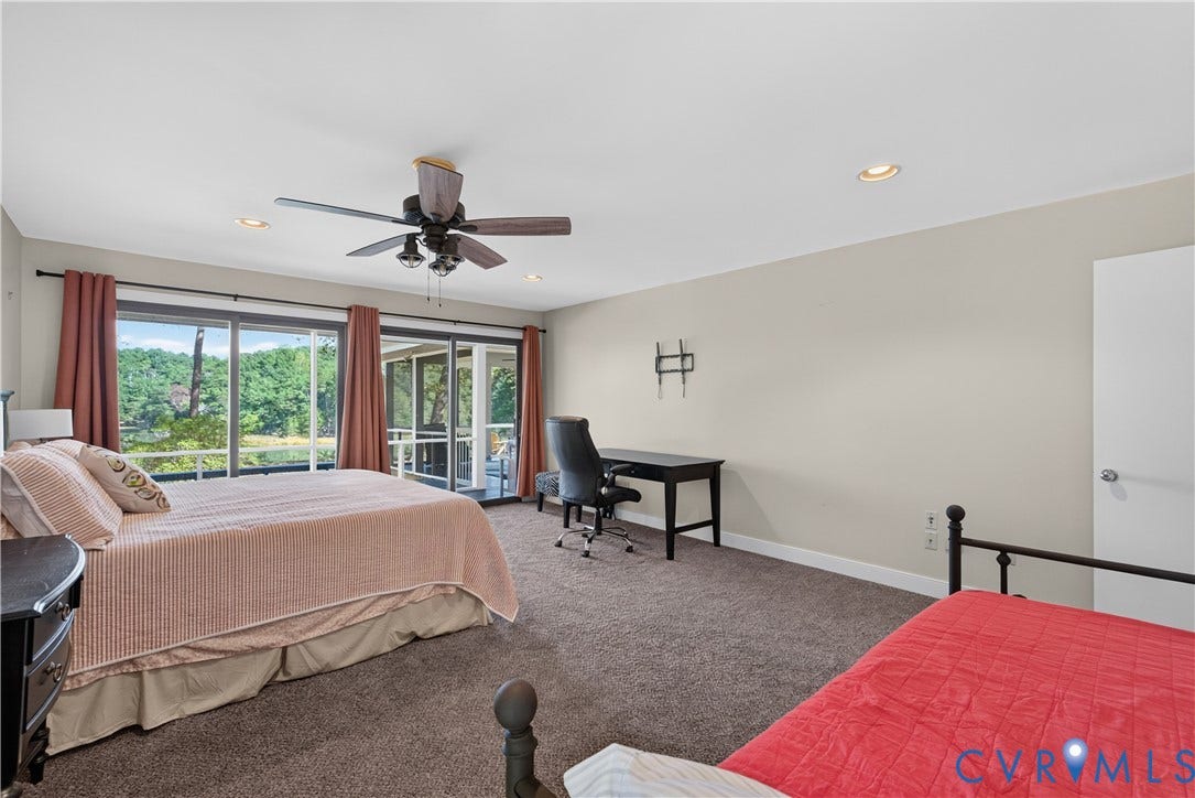 Sliding glass doors opening to an outdoor space, ceiling fan, recessed lighting, and wall-to-wall carpeting