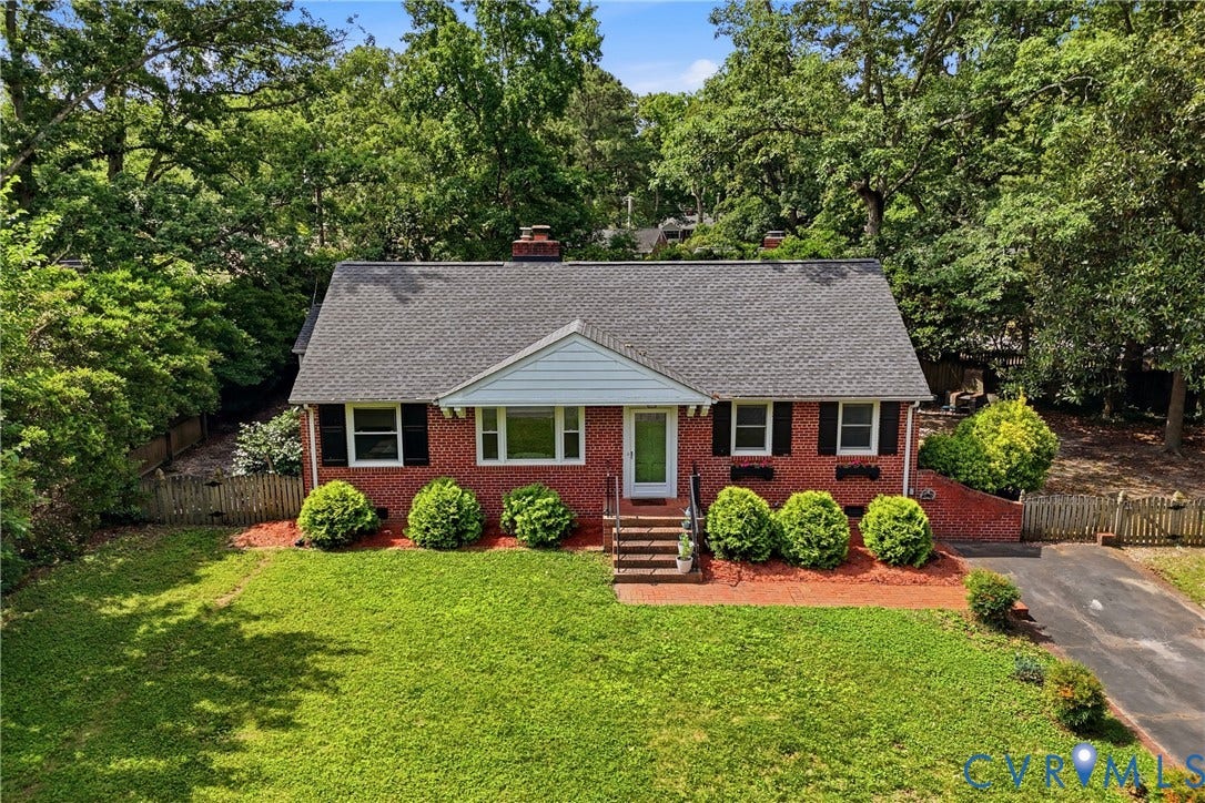 Brick exterior with a gabled roof and white trim