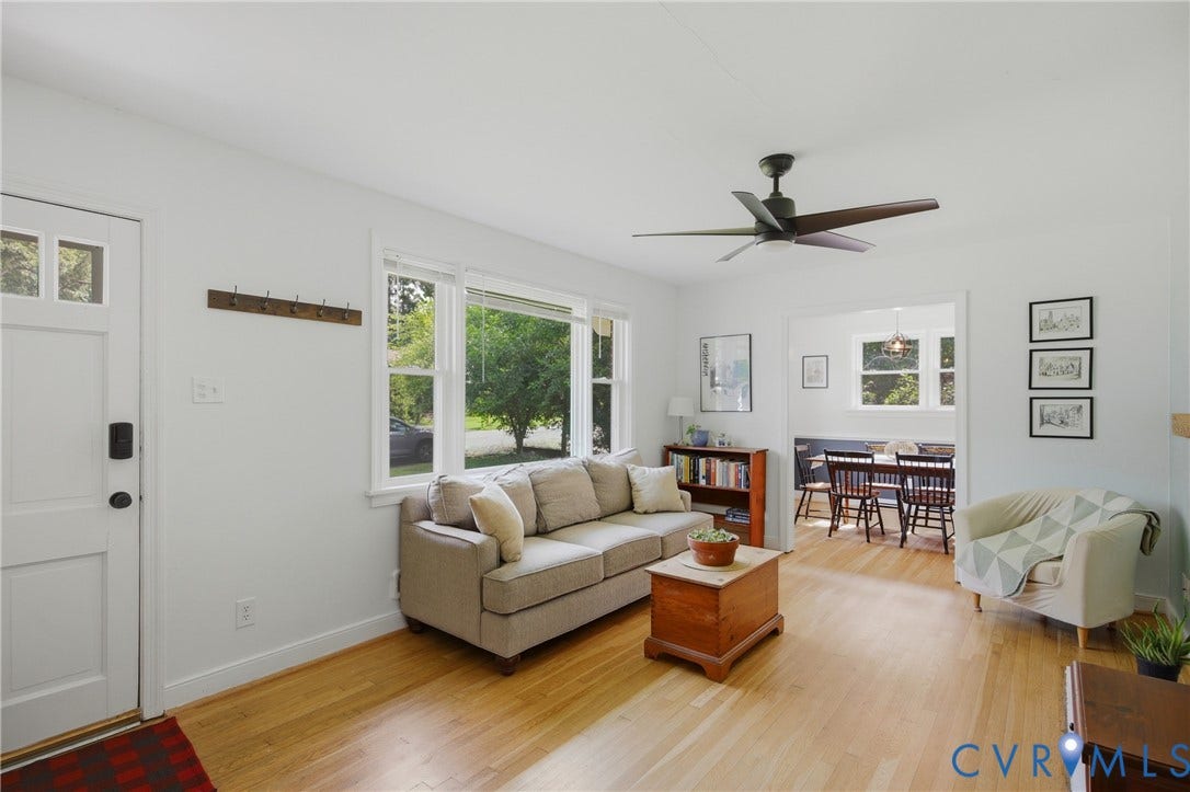 Hardwood flooring, ceiling fan, fireplace with mantle
