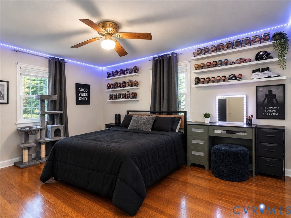 8251 Old Roxbury Road, Quinton, VA 23141 Room featuring wood-finish flooring, a ceiling fan with integrated lighting, and multiple white wall-mounted display shelves