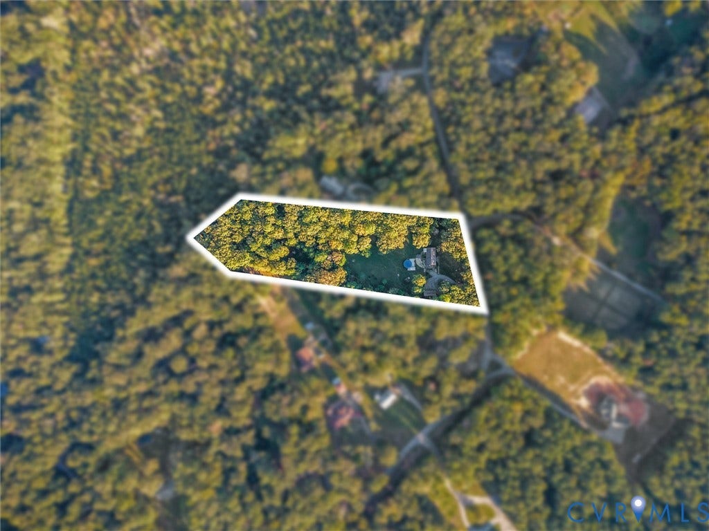 8251 Old Roxbury Road, Quinton, VA 23141 Aerial perspective of the property featuring a secluded lot with dense mature tree coverage, a manicured lawn, and a pool