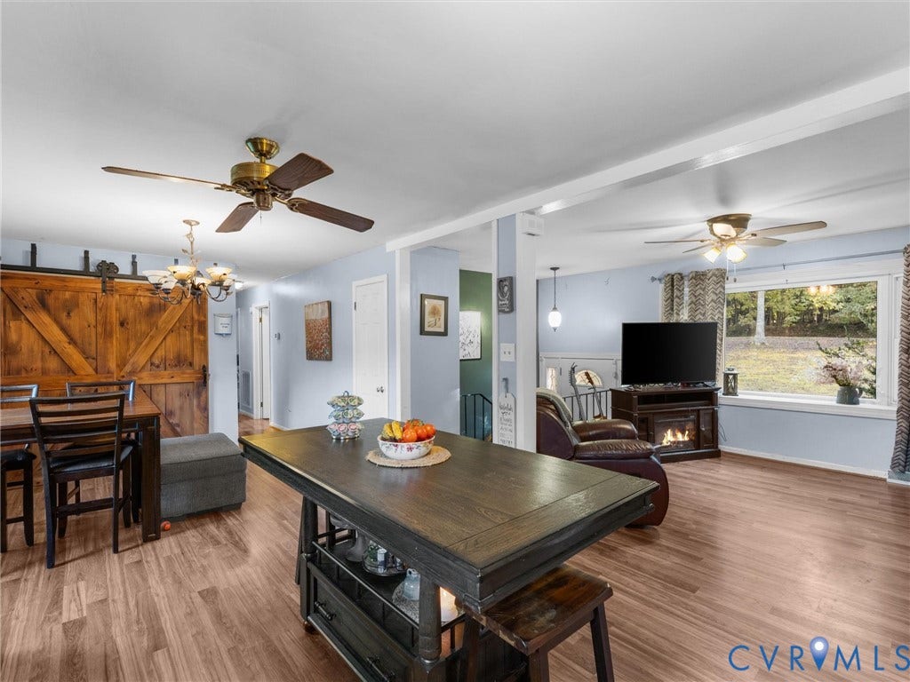 8251 Old Roxbury Road, Quinton, VA 23141 Wood-finish flooring, sliding barn door, ceiling fans, and picture window