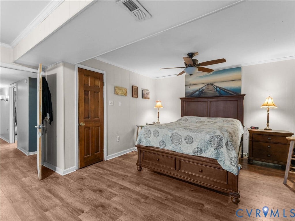 8251 Old Roxbury Road, Quinton, VA 23141 Wood-finish flooring, ceiling fan with integrated lighting, and solid wood-core interior door