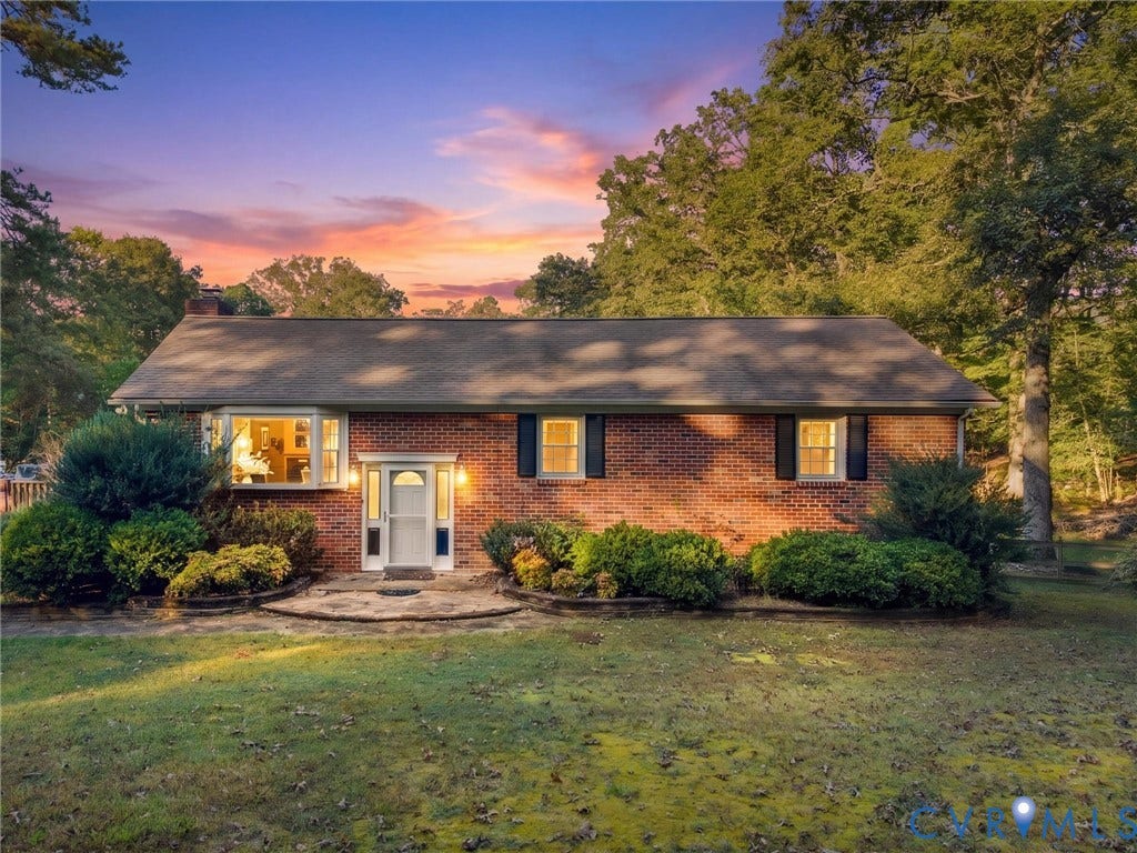 8251 Old Roxbury Road, Quinton, VA 23141 Single-story brick exterior featuring a multi-pane bay window, shuttered windows, and a stone walkway
