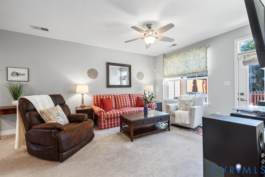 9129 Spring Green Loop, Mechanicsville, VA 23116 Spacious family room with new carpet in 2024.