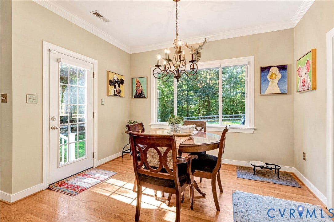 360 Laurel Drive, Aylett, VA 23009 Hardwood flooring, crown molding, white trim, recessed lighting, and a glass-paneled door