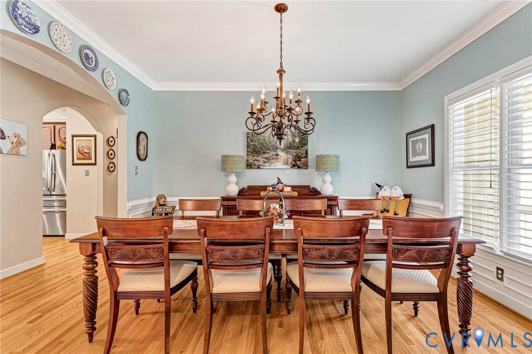 360 Laurel Drive, Aylett, VA 23009 Hardwood flooring throughout, crown molding, chair rail, and an arched entryway