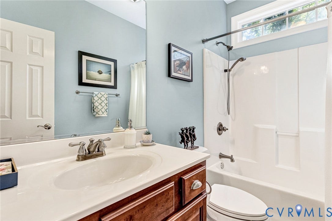 360 Laurel Drive, Aylett, VA 23009 White vanity with integrated sink, bronze-finish faucet, and coordinating hardware