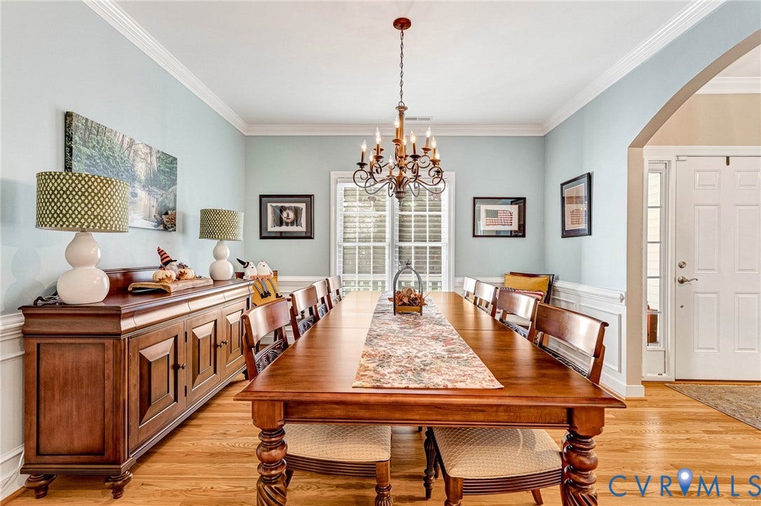 360 Laurel Drive, Aylett, VA 23009 Hardwood flooring, crown molding, chair rail, and an arched entry