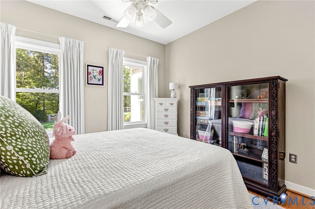 360 Laurel Drive, Aylett, VA 23009 Neutral painted walls with crown molding, wood-finish flooring, and a ceiling fan with integrated lighting