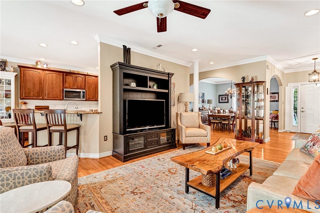 360 Laurel Drive, Aylett, VA 23009 Hardwood flooring, recessed lighting, crown molding, kitchen pass-through with breakfast bar, and an arched doorway