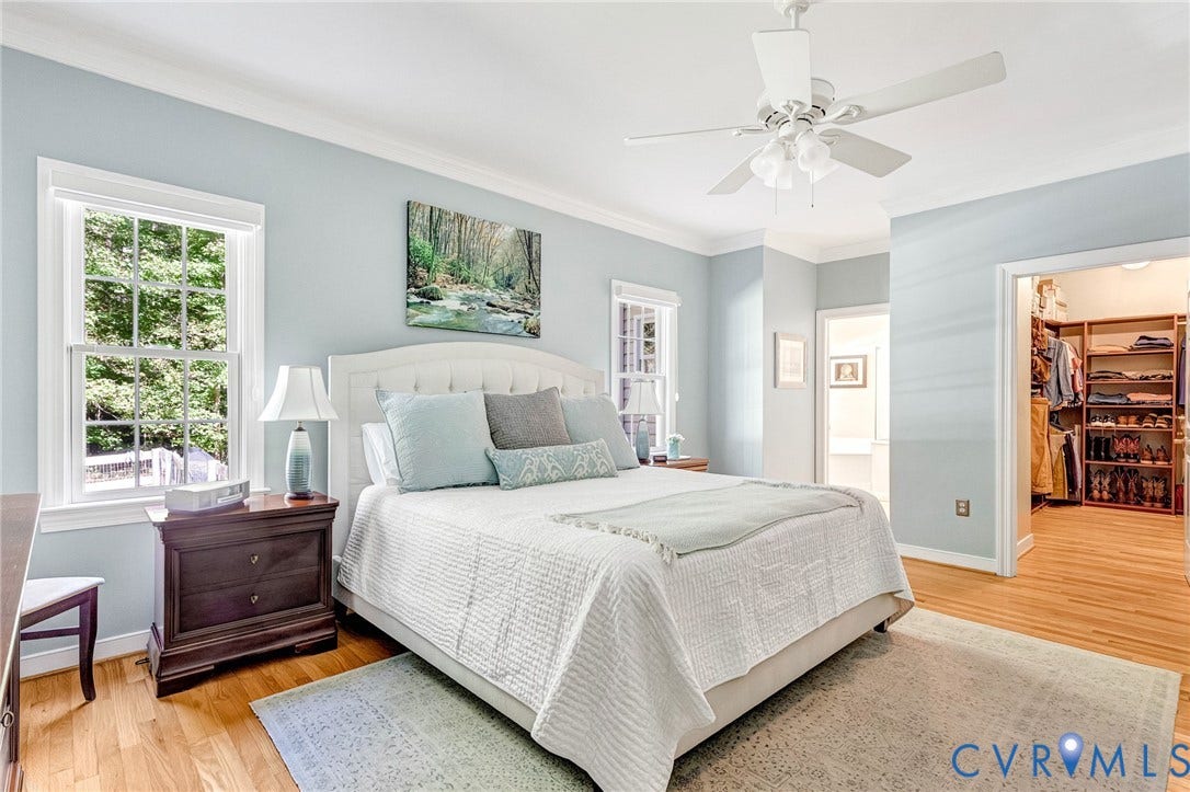 360 Laurel Drive, Aylett, VA 23009 Hardwood flooring throughout, a ceiling fan with light fixture, and a built-in closet organization system