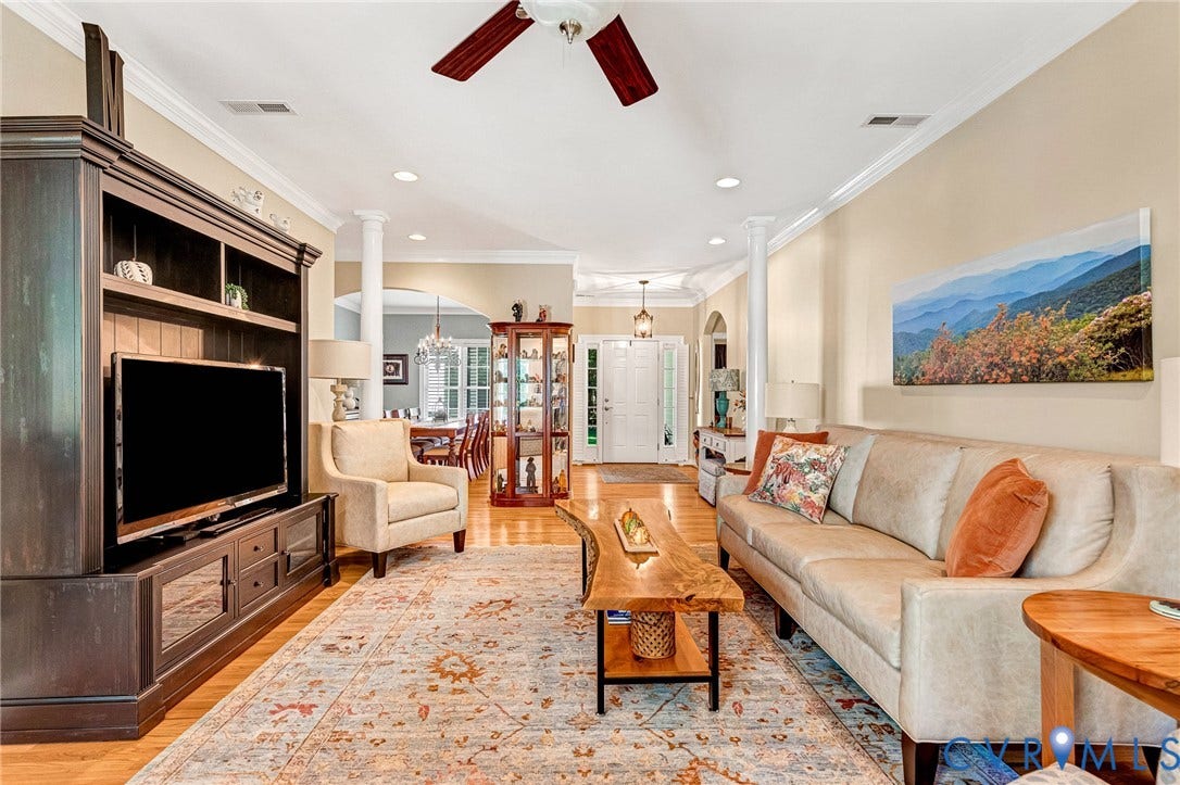 360 Laurel Drive, Aylett, VA 23009 Hardwood flooring, recessed lighting, crown molding, vaulted ceiling, and built-in media cabinetry