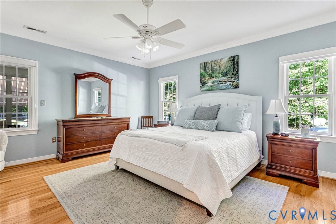 360 Laurel Drive, Aylett, VA 23009 Hardwood flooring, crown molding, white ceiling fan, and multiple windows