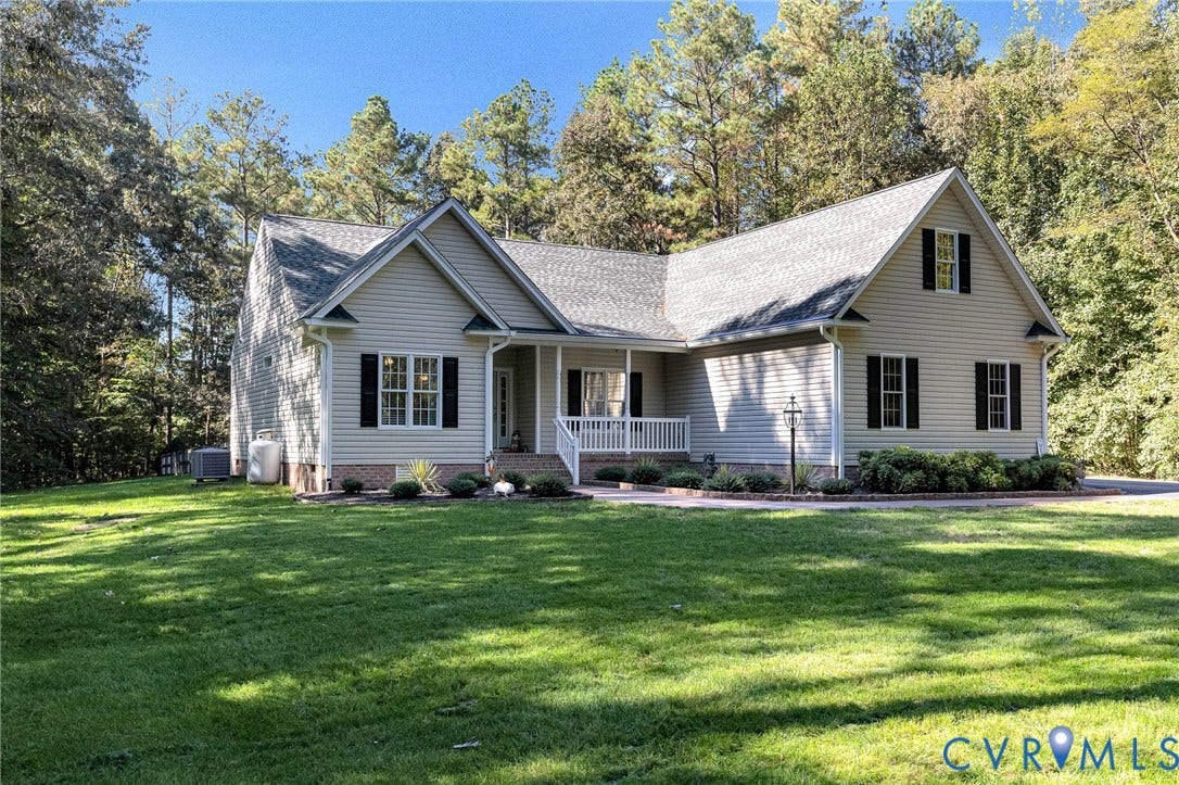 360 Laurel Drive, Aylett, VA 23009 Light-colored siding exterior with a dark-shingled roof
