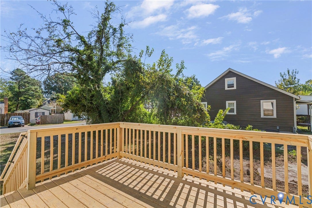 2601 Greenway Avenue, Lakeside, Henrico, VA 23228 Elevated wooden deck featuring vertical balusters, a sturdy handrail, and exterior stairs