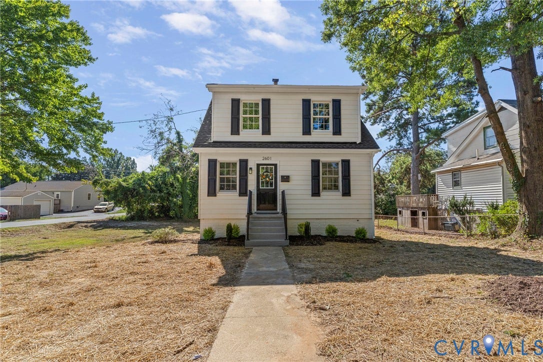 2601 Greenway Avenue, Lakeside, Henrico, VA 23228 Dutch Colonial residence featuring light-toned horizontal siding, dark decorative shutters, a central entrance with stairs, and multi-pane windows