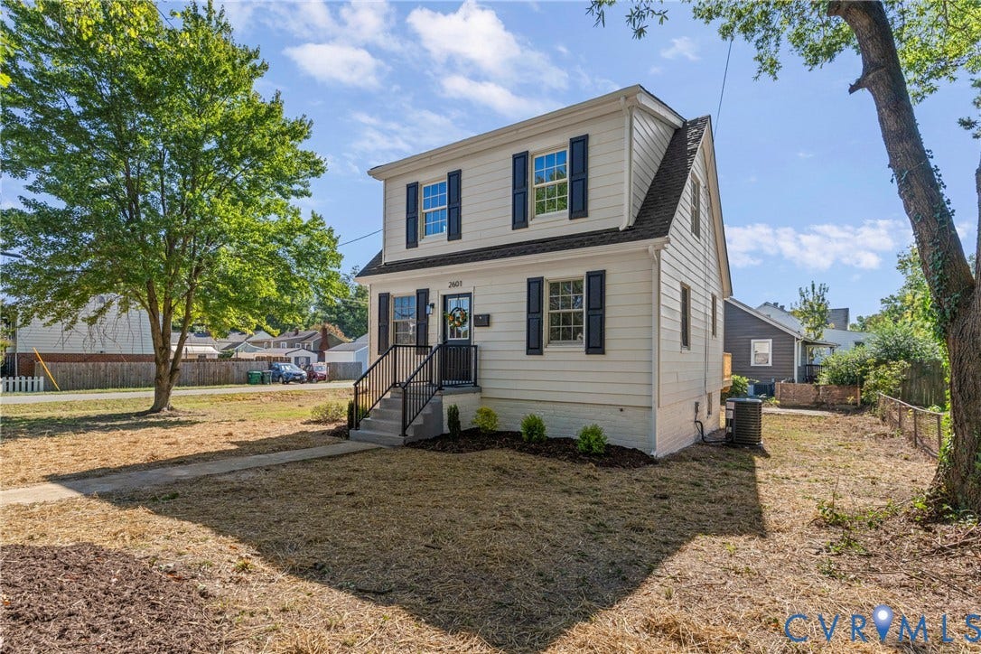 2601 Greenway Avenue, Lakeside, Henrico, VA 23228 Dutch Colonial exterior featuring light-toned horizontal siding, dark decorative window shutters, and metal handrails at the front entryway