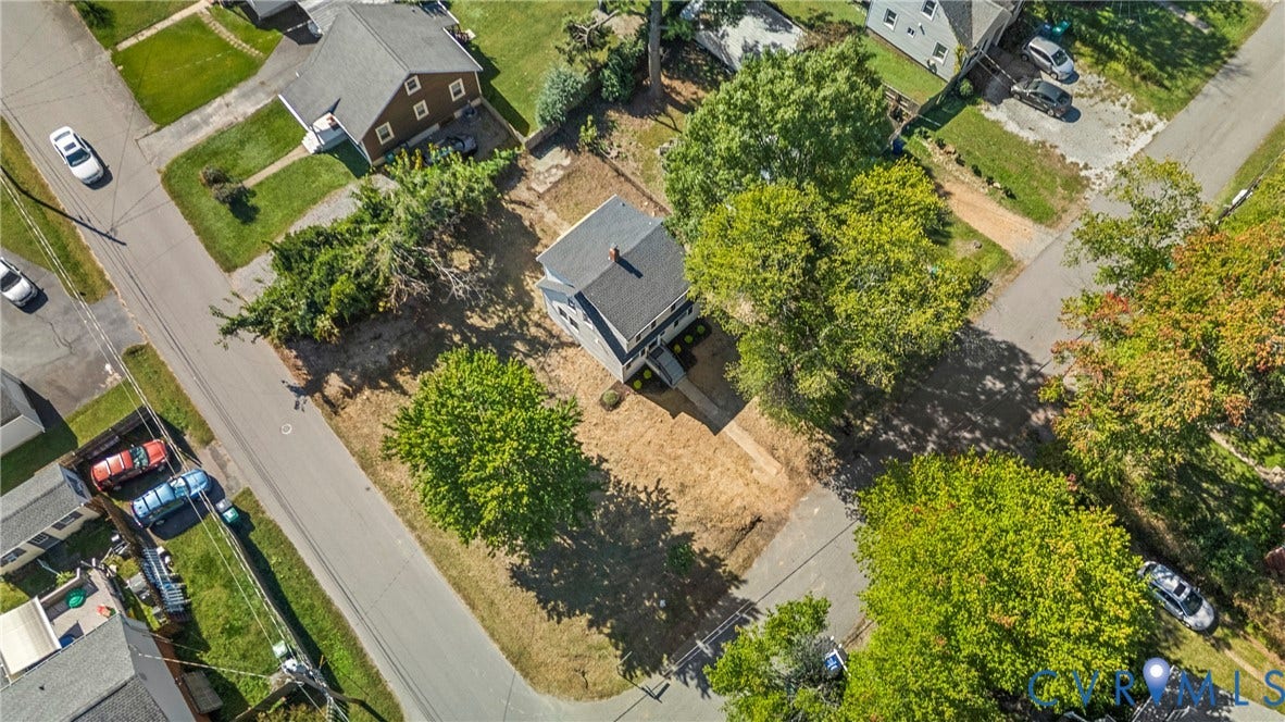 2601 Greenway Avenue, Lakeside, Henrico, VA 23228 Aerial view of a detached residence featuring a shingled roof, a paved walkway, and mature trees situated on a corner lot