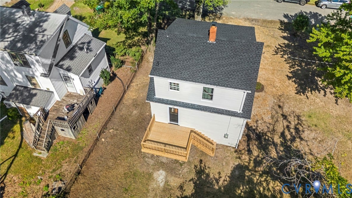 2601 Greenway Avenue, Lakeside, Henrico, VA 23228 Two-story exterior featuring white siding, a dark shingled roof, a chimney stack, and a wooden rear deck