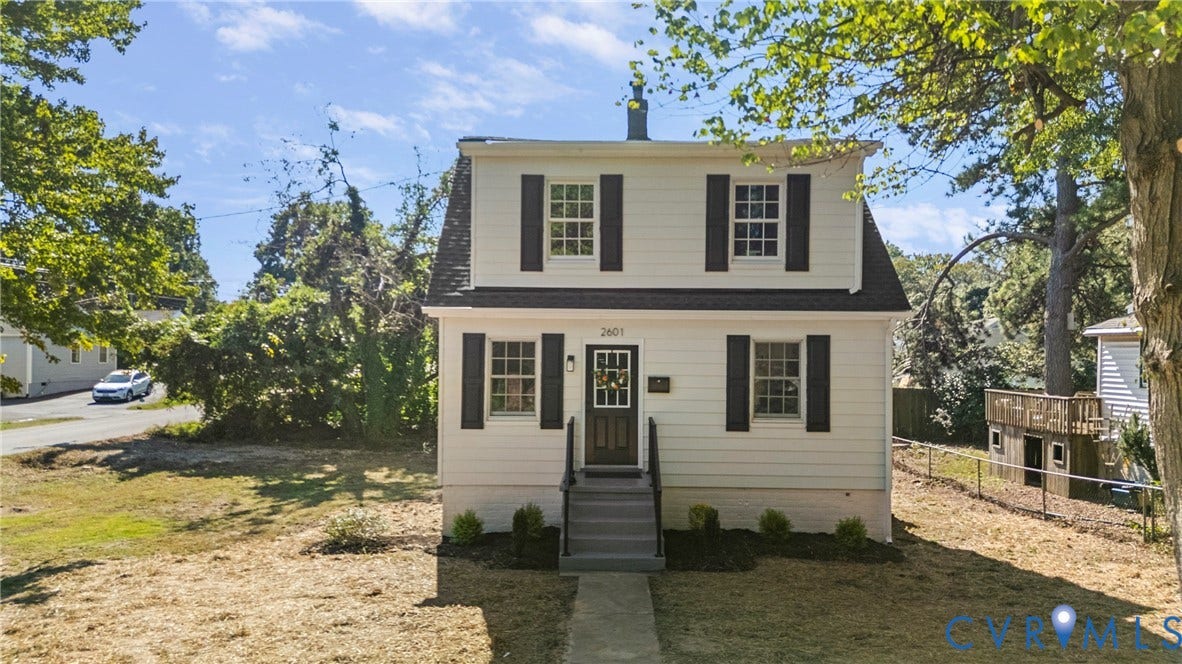 2601 Greenway Avenue, Lakeside, Henrico, VA 23228 Two-story Dutch Colonial exterior featuring light-colored siding, dark shutters, a front entry with a multi-pane glass door, and a concrete walkway
