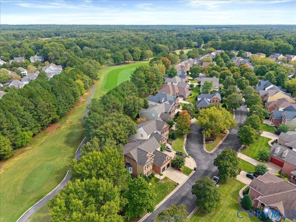 12126 Club Commons Drive, Club Commons, Glen Allen, VA 23059 Residential community with mature tree canopies, multi-story homes, and a manicured golf course bordering the property