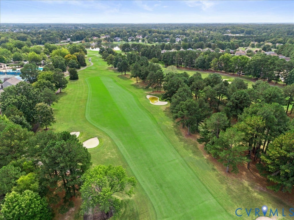 12126 Club Commons Drive, Club Commons, Glen Allen, VA 23059 Expansive golf course fairway with manicured turf, sand traps, mature trees, and a distant body of water