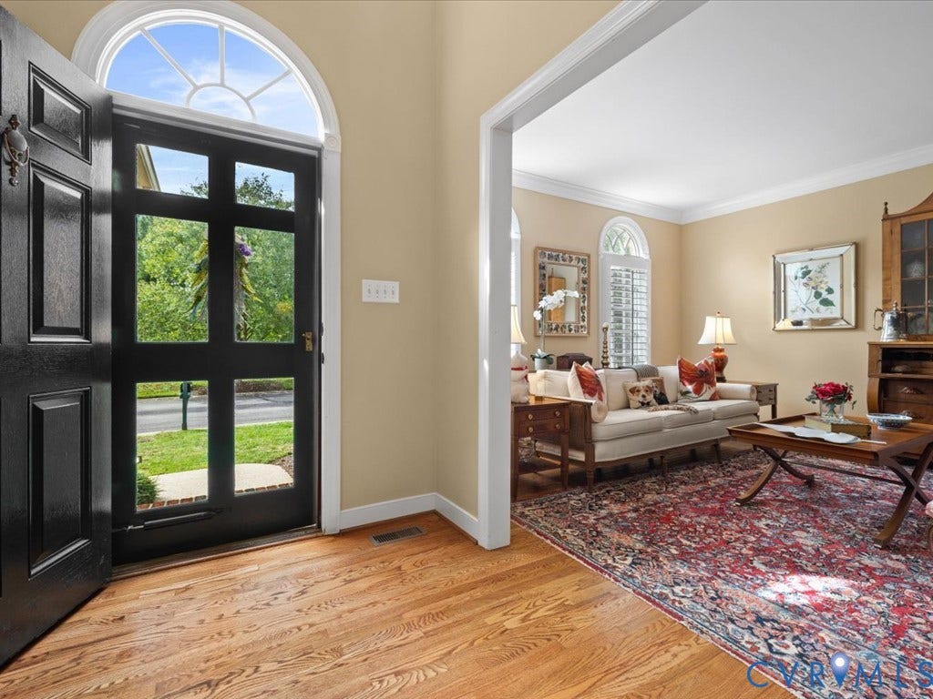 12126 Club Commons Drive, Club Commons, Glen Allen, VA 23059 Hardwood flooring, arched transom window, paneled entry door, interior wall trim, and cased opening