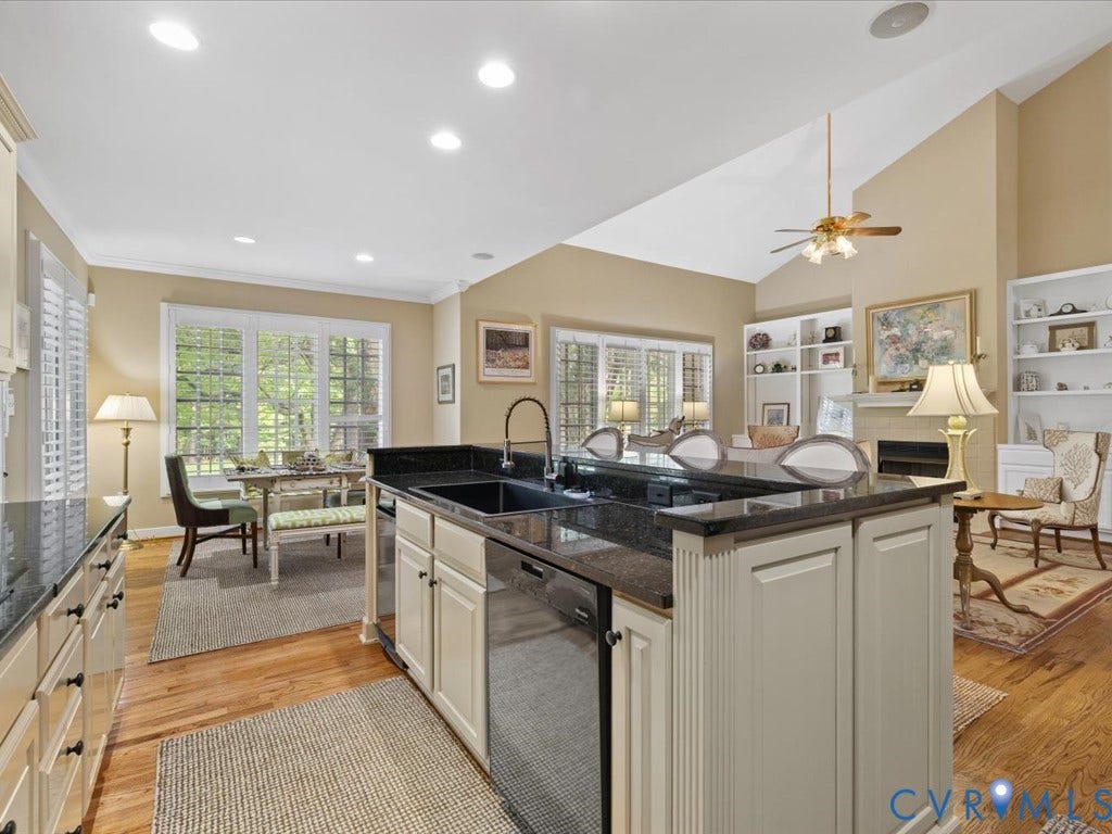 12126 Club Commons Drive, Club Commons, Glen Allen, VA 23059 Kitchen island with dark countertops, built-in dishwasher, and a deep sink with a gooseneck faucet