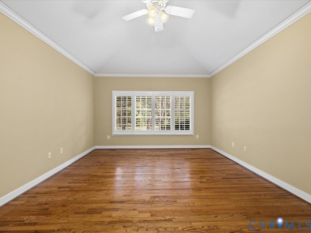 12126 Club Commons Drive, Club Commons, Glen Allen, VA 23059 Vaulted ceiling with crown molding, ceiling fan with integrated lighting, wood-finish flooring, and a large window with white plantation shutters