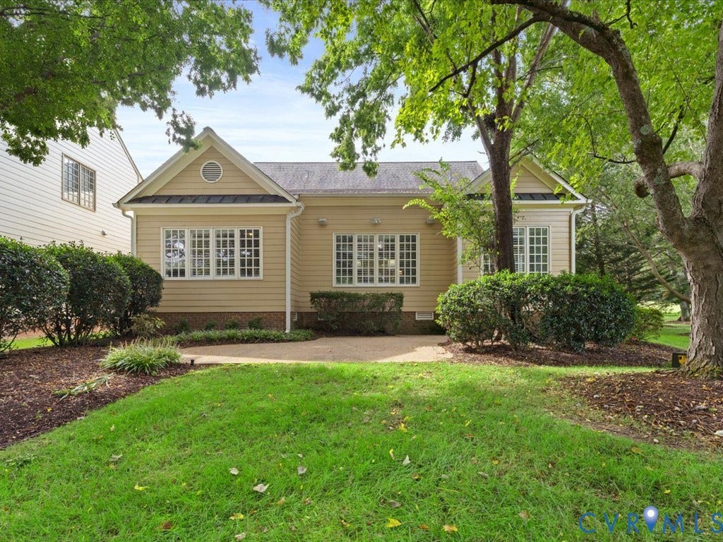 12126 Club Commons Drive, Club Commons, Glen Allen, VA 23059 Rear exterior with light tan siding and multiple windows, surrounded by mature trees and manicured landscaping