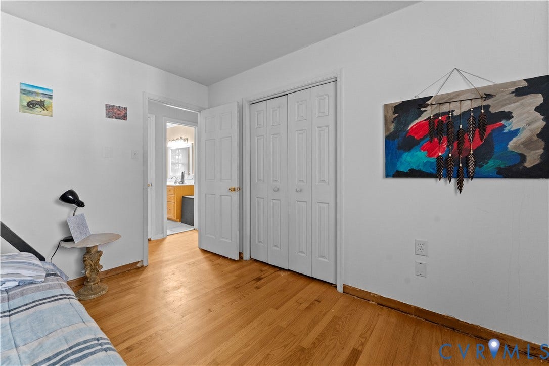 109 Webster Road, Sandston, VA 23150 Hardwood flooring throughout, white walls, and a white bi-fold closet door