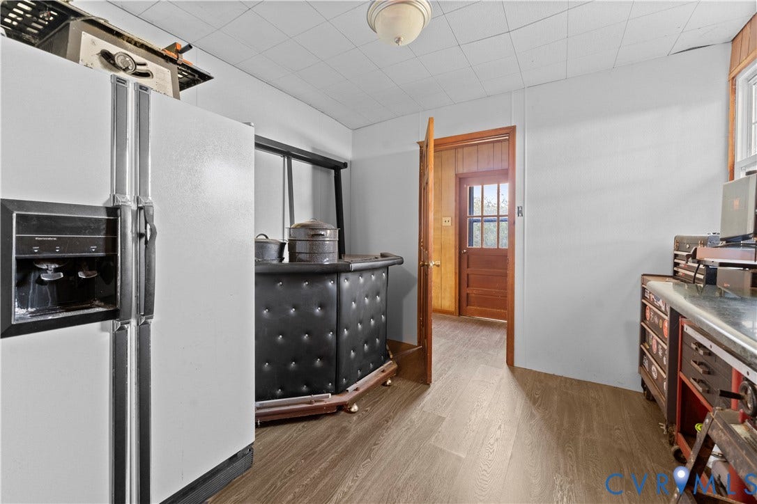 109 Webster Road, Sandston, VA 23150 Wood-finish flooring with white walls and a ceiling light fixture