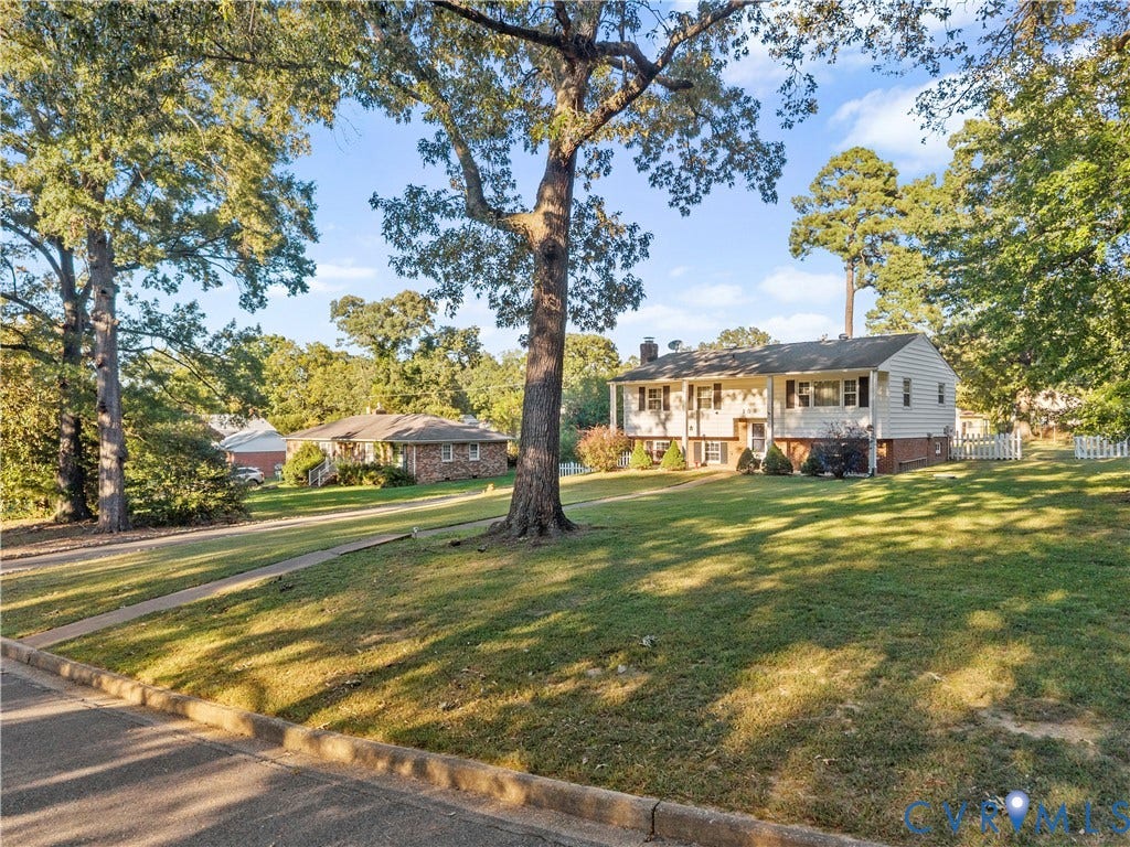 109 Webster Road, Sandston, VA 23150 Split-level residence featuring white siding and dark shutters