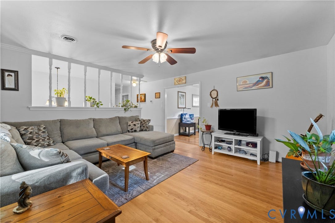 109 Webster Road, Sandston, VA 23150 Hardwood flooring throughout, ceiling fan with integrated lighting, and a partial wall with decorative balusters