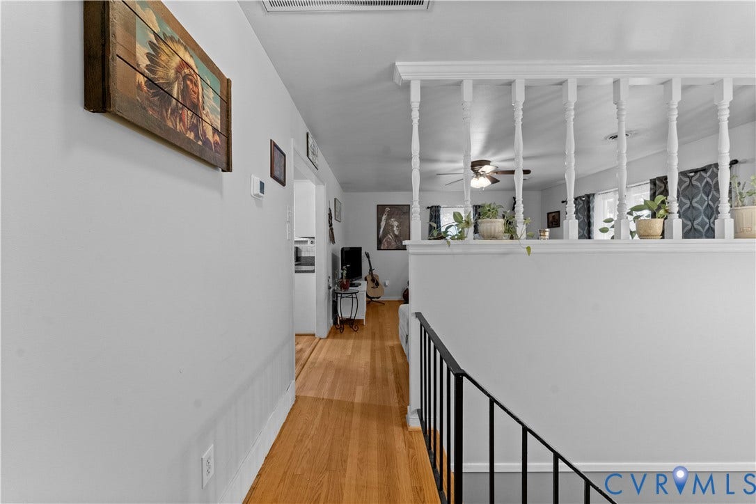 109 Webster Road, Sandston, VA 23150 Wood-finish flooring throughout, white painted walls, and decorative white railing