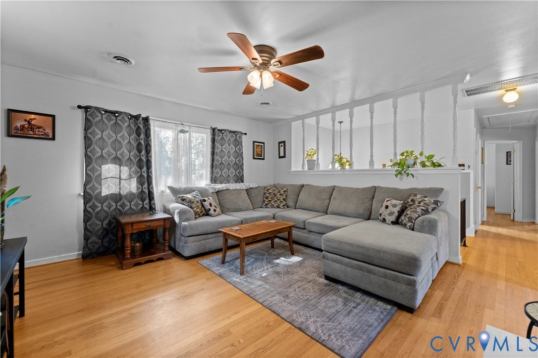 109 Webster Road, Sandston, VA 23150 Hardwood-finish flooring throughout, ceiling fan with integrated lighting, and a decorative half-wall with spindles