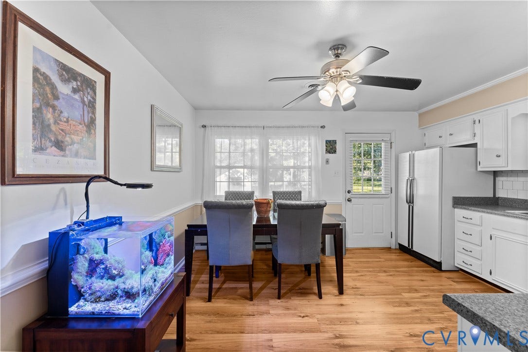 109 Webster Road, Sandston, VA 23150 Wood-finish flooring, white cabinetry, light-toned countertops, and a ceiling fan with integrated lighting