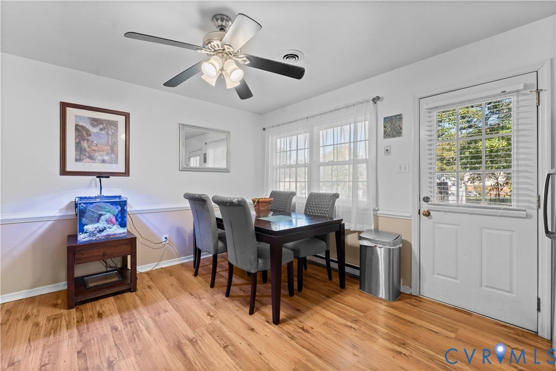 109 Webster Road, Sandston, VA 23150 Wood-finish flooring, ceiling fan with integrated lighting, two-tone wall treatment, and multiple windows