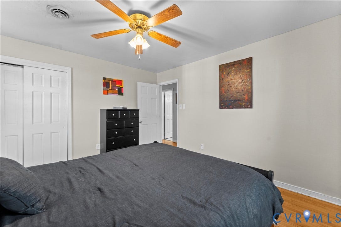 109 Webster Road, Sandston, VA 23150 Light-colored walls, wood-finish flooring, white paneled doors, and a ceiling fan