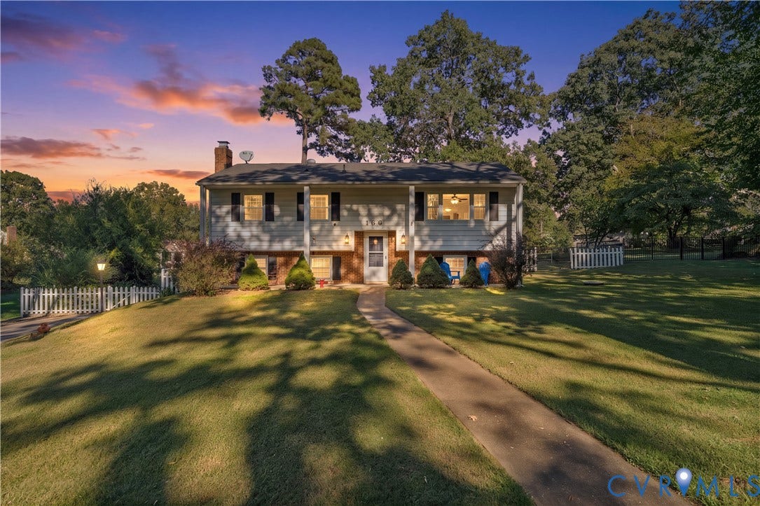 109 Webster Road, Sandston, VA 23150 Split-level residence featuring a pitched roofline, an expansive front lawn, and a winding concrete pathway