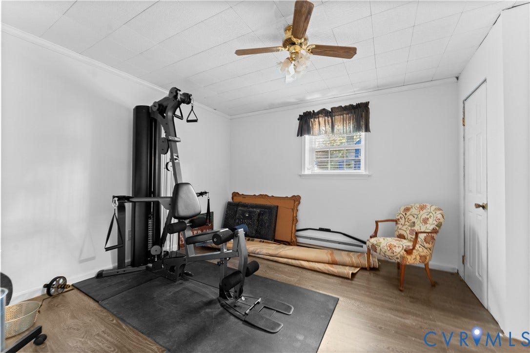109 Webster Road, Sandston, VA 23150 Wood-finish flooring, white walls, and a ceiling fan with integrated lighting