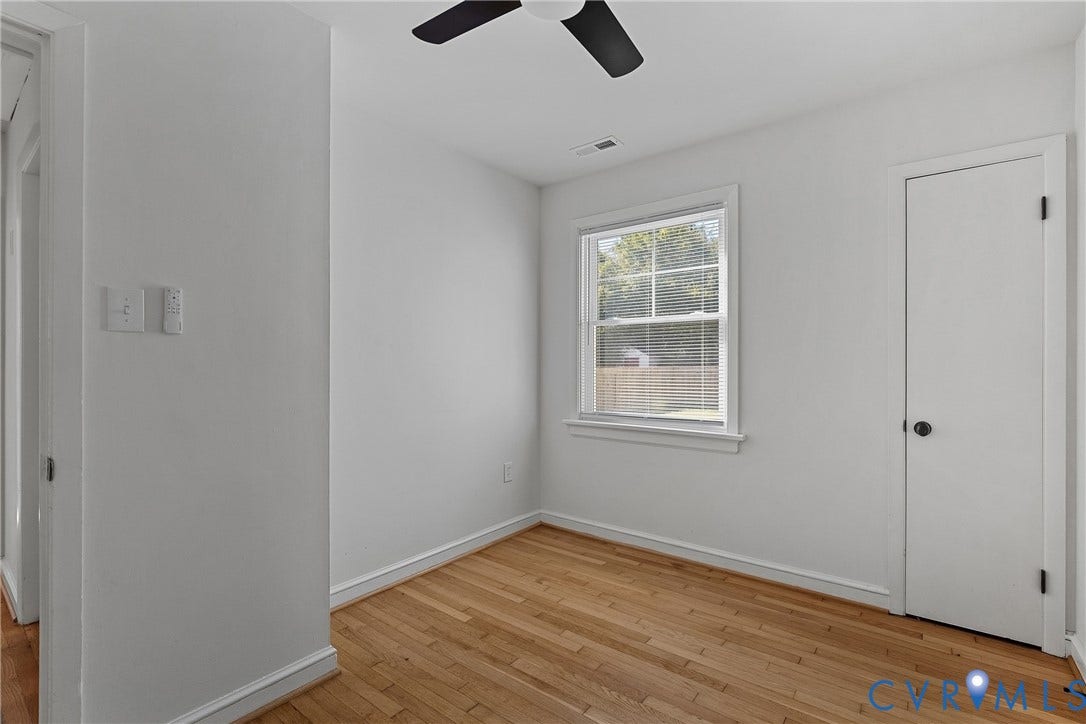 5304 Gillespie Avenue, Henrico, VA 23228 Wood-finish flooring, white trim, and a window with blinds