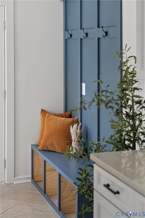 5304 Gillespie Avenue, Henrico, VA 23228 Built-in bench with integrated open shelving, vertical paneling, and wall-mounted hooks