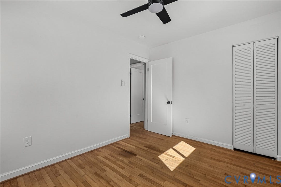 5304 Gillespie Avenue, Henrico, VA 23228 Hardwood flooring, painted walls, white trim, a ceiling fan, and louvered bi-fold closet doors