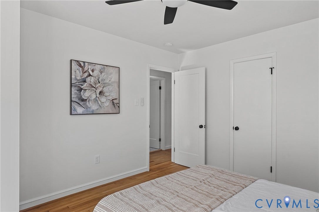 5304 Gillespie Avenue, Henrico, VA 23228 Hardwood-finish flooring, white walls, and a ceiling fan with black blades