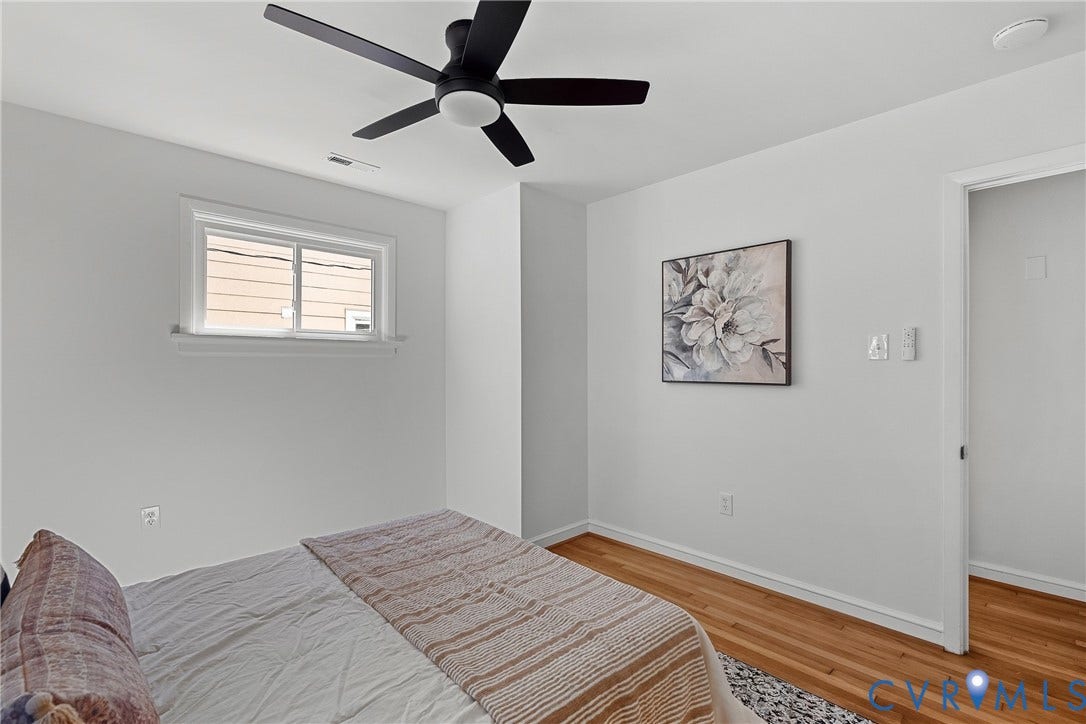 5304 Gillespie Avenue, Henrico, VA 23228 Hardwood flooring, white walls, and a black ceiling fan